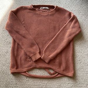 Light brown / orange sweater with cut outs on back